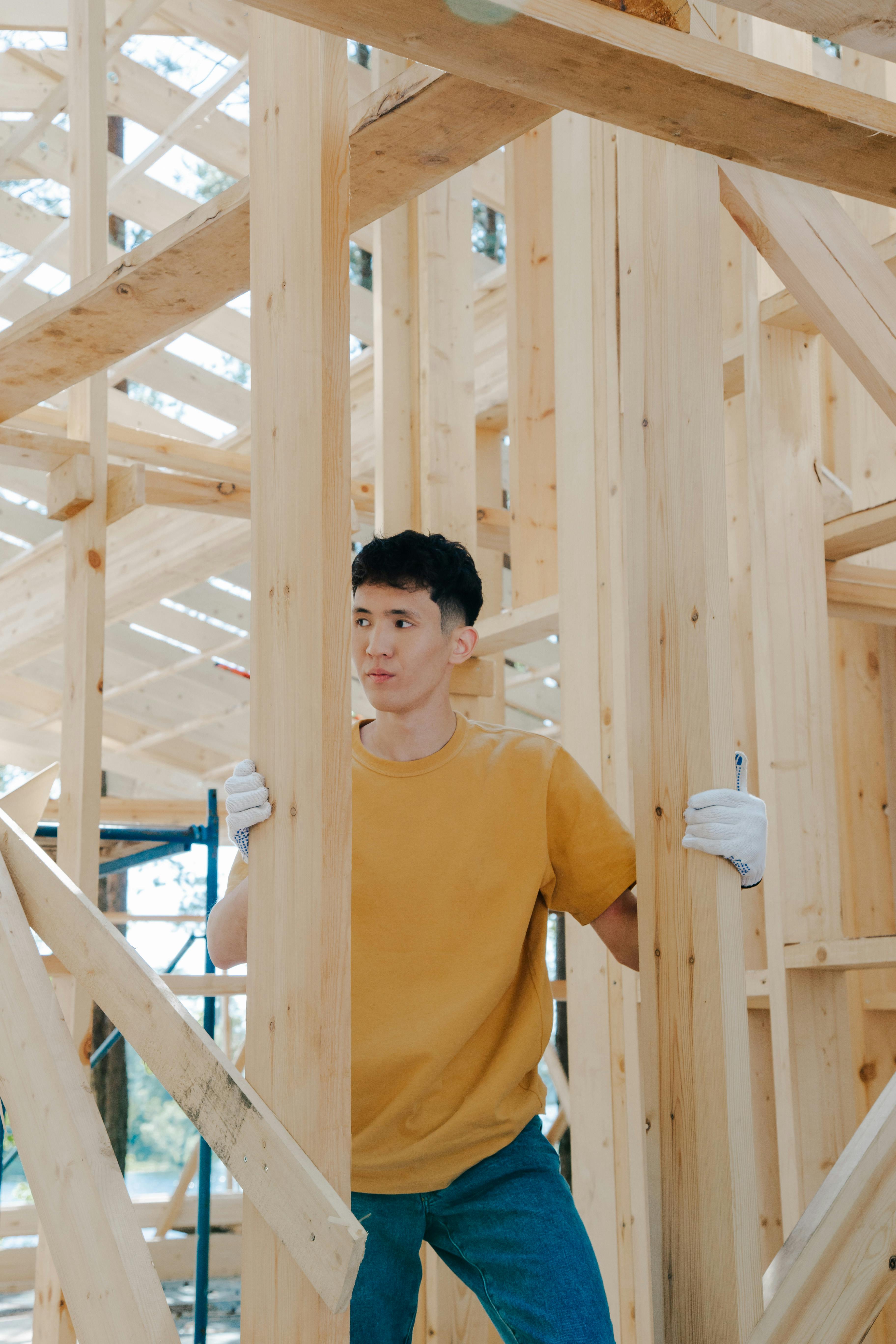 Construction worker in wood framing of new home build